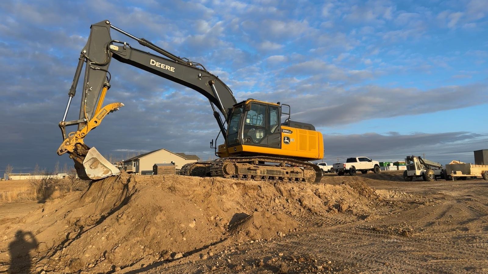 Sage Dirtworks excavator on job site